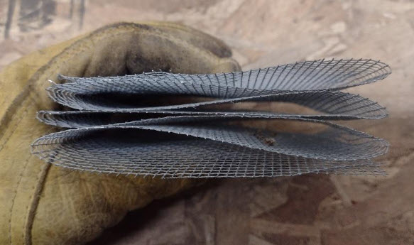 Strip of hardware cloth folded accordion style.